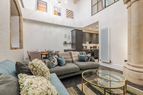 In this spacious living space, sink into our plush sofas and unwind!