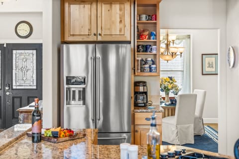 Top of the line kitchen with stainless steel appliances and granite countertops.