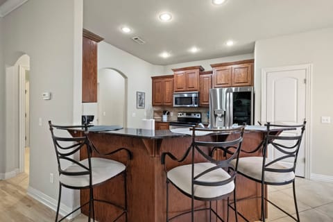 Additional barstool seating for 3 at the kitchen counter!