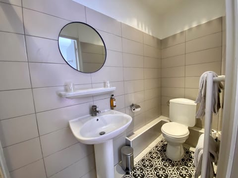 Double Standard Room, road side | Bathroom | Hair dryer, towels