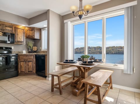 Gather for meals together with a lake view at the dining table, seating 4