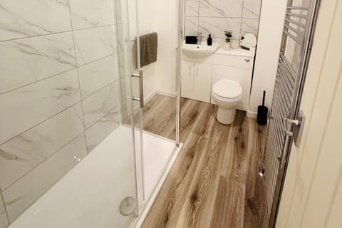 Shower, hair dryer, towels, toilet paper