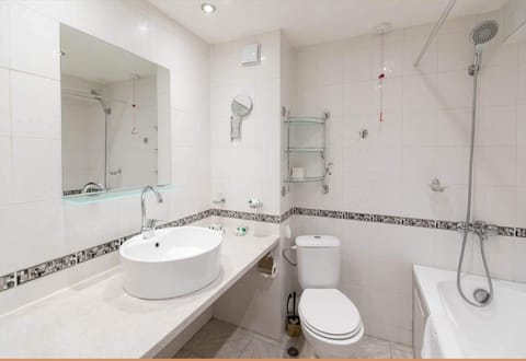 Separate tub and shower, free toiletries, hair dryer, slippers