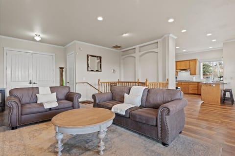 Main conversation area in the living room adjacent to the large gourmet kitchen.