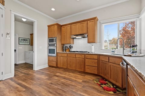 Large gas stovetop perfect for cooking in and enjoying this gorgeous home!