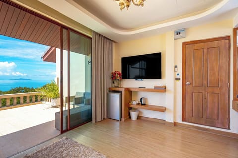 Deluxe Triple Room, Balcony, Sea View | In-room safe, desk, laptop workspace, blackout drapes