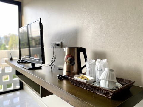 Family Studio Suite, City View | Living area | 45-cm LCD TV with cable channels