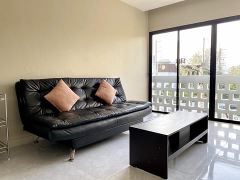 Family Studio Suite, City View | Living area | 45-cm LCD TV with cable channels