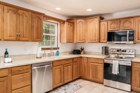 Fully equipped kitchen with modern appliances for home-cooked meals.