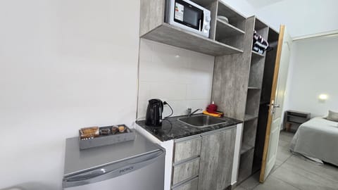 Standard Apartment, Garden View | Private kitchenette | Fridge, microwave, cookware/dishes/utensils