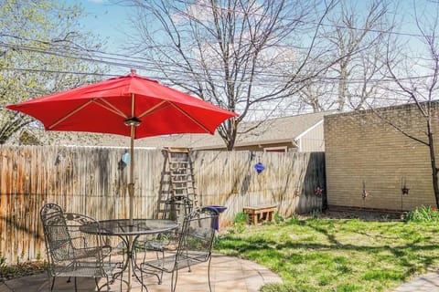 The backyard offers a spacious and inviting outdoor area, complete with seating and a table, perfect for relaxing, dining, or enjoying the fresh air.