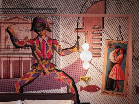 Deluxe Triple Room, Garden View | Minibar, in-room safe, blackout drapes, free WiFi