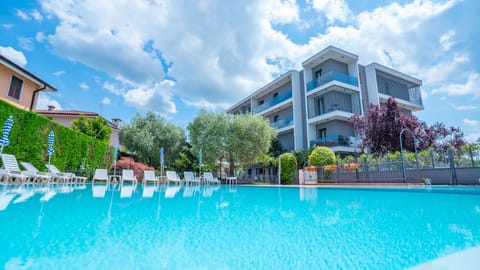 Seasonal outdoor pool, pool umbrellas, sun loungers