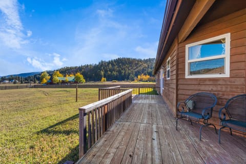 Back Deck - The back deck is the perfect place to unwind and enjoy the view of the mountains.  The large, fenced yard is ideal for your dog.