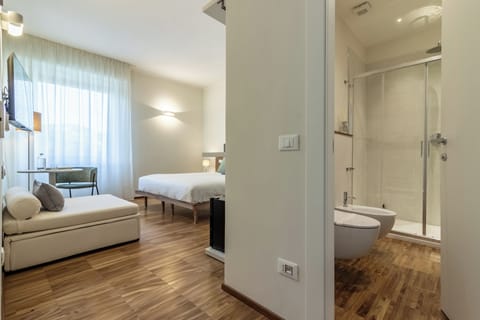 Deluxe Triple Room, City View | In-room safe, desk, laptop workspace, blackout drapes