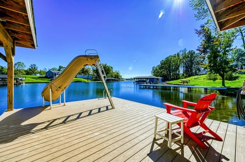 Unwind by the lakeside fire pit, surrounded by stunning water views and outdoor amenities for a perfect retreat.