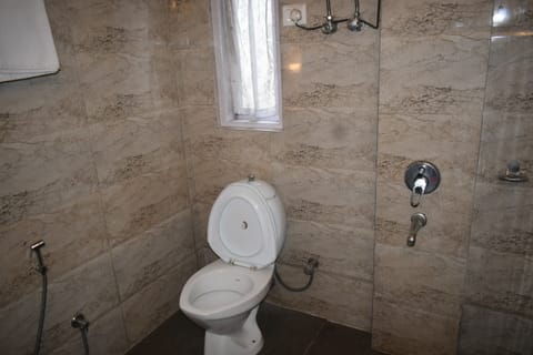 Deluxe Double Room, City View | Bathroom | Shower, rainfall showerhead, towels, soap