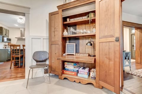 Relax and unwind in our cozy nook stocked with classic board games, glassware, and fun decor – perfect for making memories during your stay!