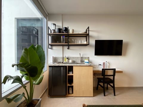 Apartment (406) | Private kitchen | Mini-fridge, microwave, cookware/dishes/utensils