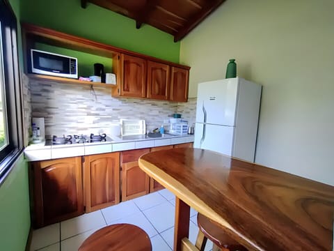 Family Cottage, Garden View | Private kitchen | Microwave, stovetop, cookware/dishes/utensils