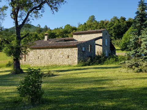 Stone house in a peaceful, green setting