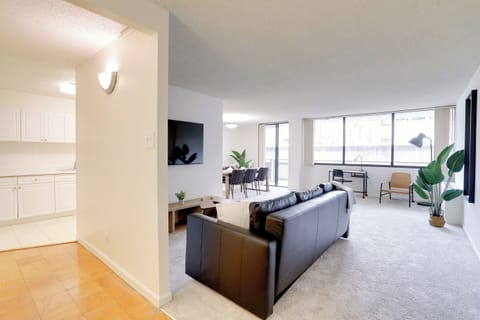 Apartment, City View | Living area | 50-inch Smart TV with cable channels