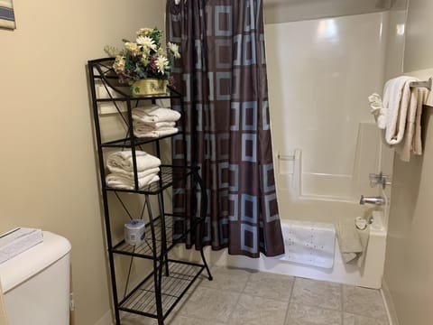 Condo, 2 Bedrooms (205) | Bathroom | Combined shower/tub, hair dryer, towels