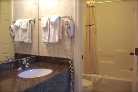 Room, 2 Queen Beds | Bathroom | Combined shower/tub, free toiletries, hair dryer, towels