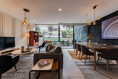 Wide-angle view of the open living and dining areas, perfect for group gatherings.