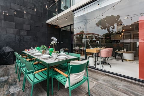 Patio dining space complete with string lights, creating a magical atmosphere for evening gatherings.