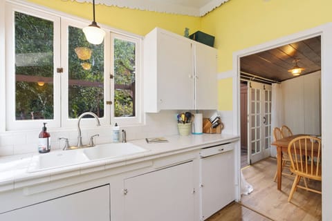 Original cupboards, hardware and fixtures throughout.