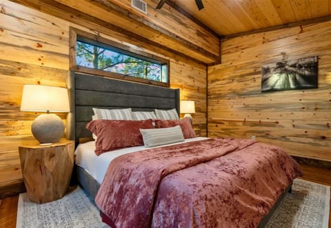 Combining rustic elegance and modern comfort, this bedroom provides a perfect space to relax and recharge.
