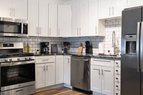 As you approach kitchen the elegant layout and well-stocked shelves make it the ideal spot to relax.