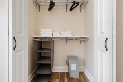 Modern built-in closets with hangers and shelving, perfect for keeping your clothes organized during your stay.