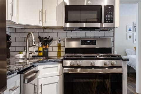 The kitchen’s open layout allows you to move freely as you prepare meals, with everything you need at your fingertips.