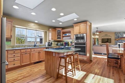 Well equipped kitchen with island and skylights