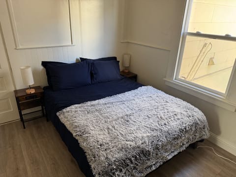 Queen Bed with 4 Pillows and Premium Linens