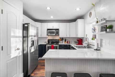 This kitchen is fully stocked with stainless steel appliances and plenty of space to cook a perfect meal