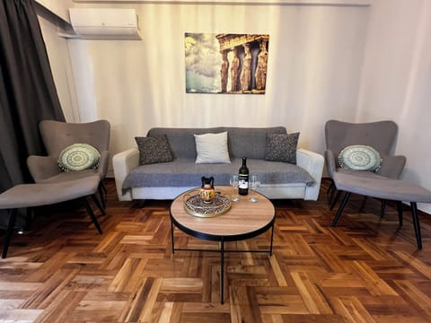 Apartment, City View | Living area | 40-inch flat-screen TV with digital channels