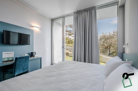Classic Double Room, Balcony | Minibar, in-room safe, desk, free WiFi