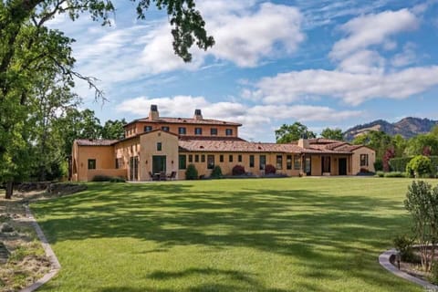 Featuring immaculately manicured lawns and a stunning mountain backdrop