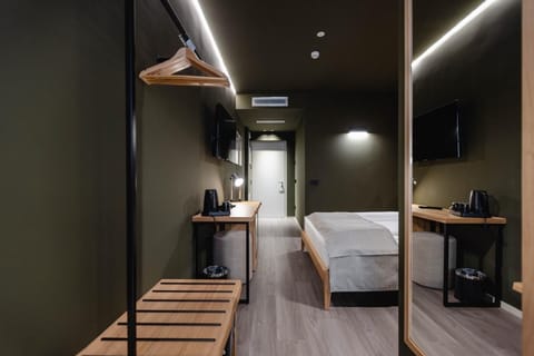 Standard Double Room | Minibar, in-room safe, desk, blackout drapes