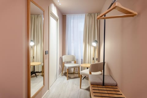 Standard Double Room | Minibar, in-room safe, desk, blackout drapes