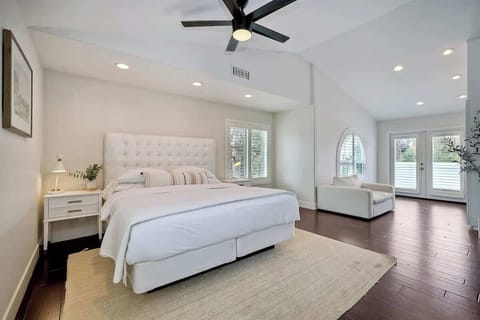 King bed in primary bedroom with smart TV