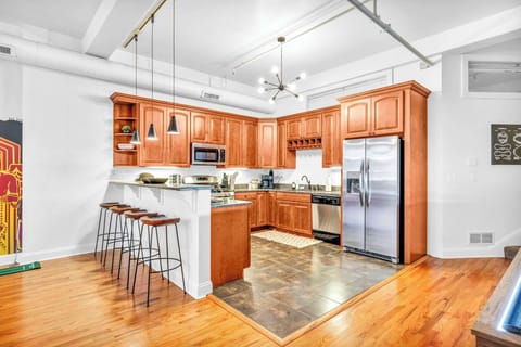 Whip Up Gourmet Meals in This Chic, Modern Kitchen! Spacious, fully-equipped, and ready for your culinary adventures. Perfect for group cooking and entertaining!