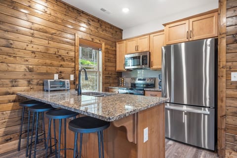 Fully Equipped Kitchen with Additional Bar Seating