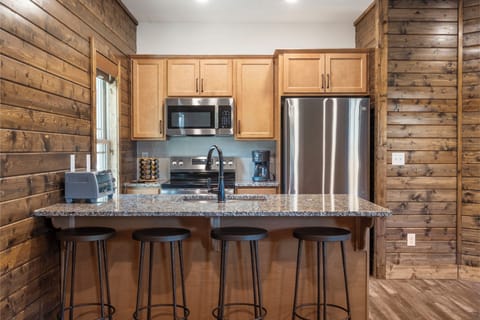 Fully Equipped Kitchen with Additional Bar Seating