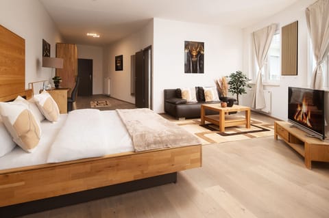 Superior Double Room, Garden View | Living area | 120-cm LED TV with satellite channels, offices