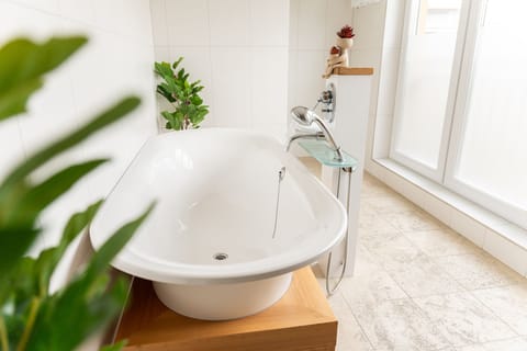 Luxury Studio, Garden View | Bathroom | Hair dryer, towels, soap, shampoo