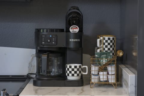 Coffee bar with Keurig cups as well as coffee pot capabilities.